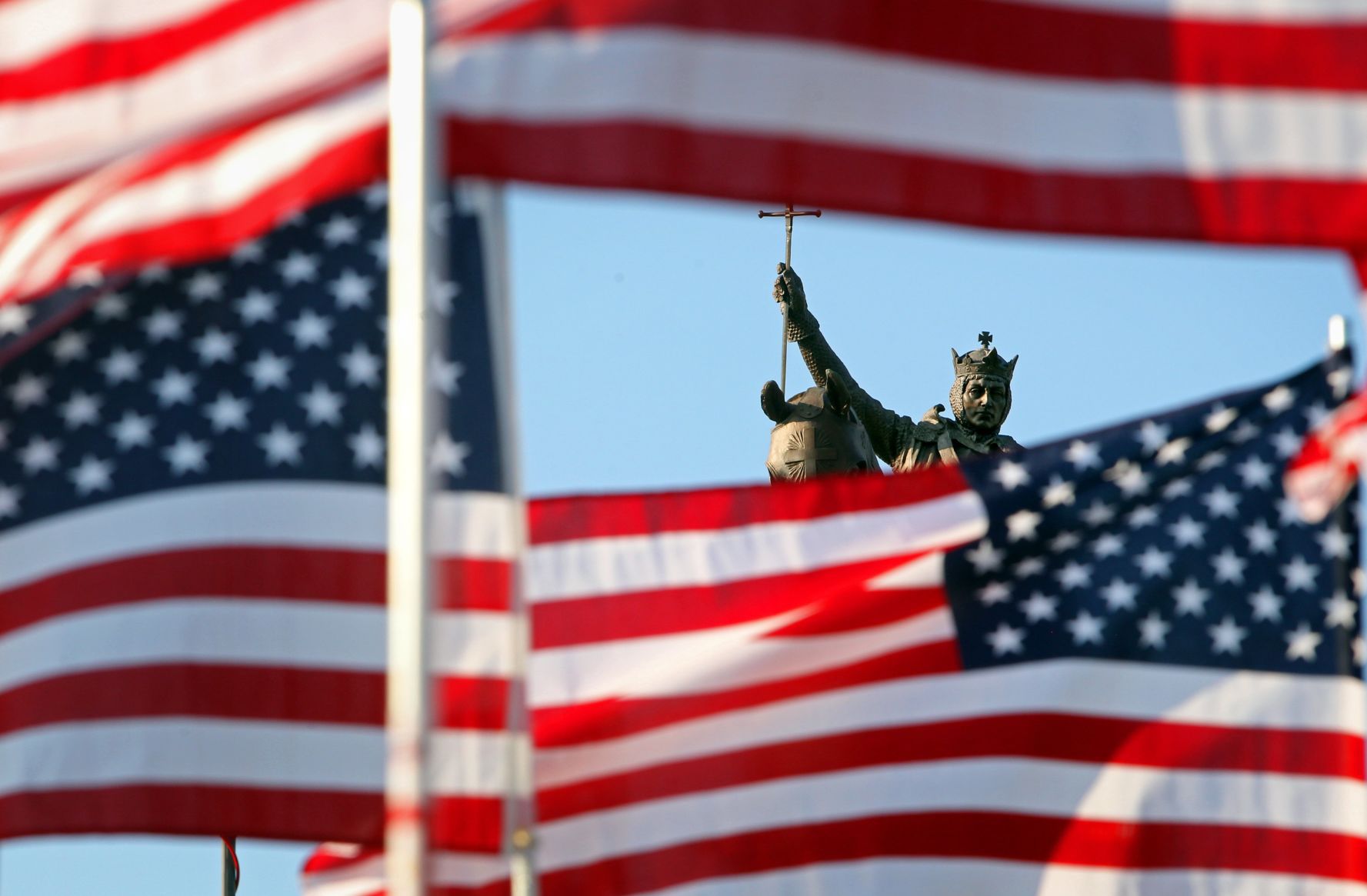 Flags frame King Louis IX statue on Art Hill
